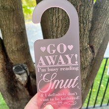 Load image into Gallery viewer, Go Away! I'm busy reading Smut... Door Hanger
